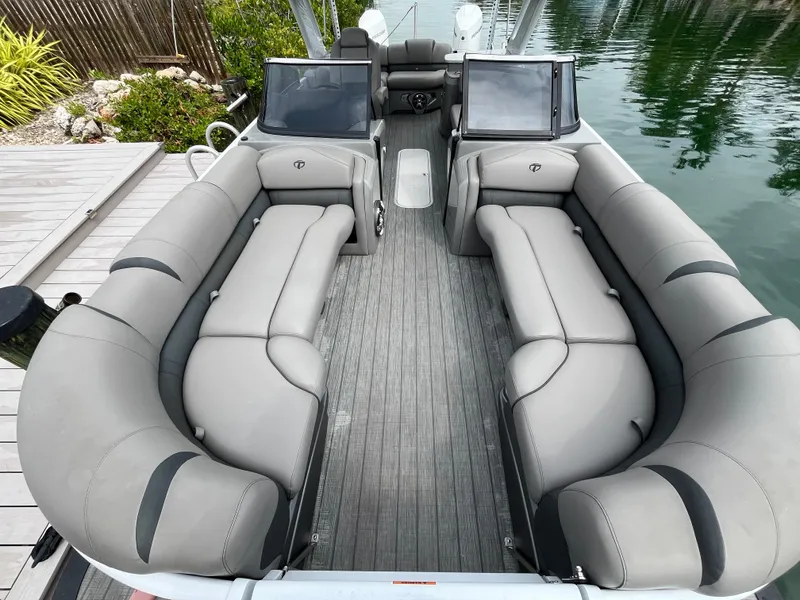 Slide: The Image of 2021 Tahoe Grand Tahoe ELW pontoon boat with spacious seating and modern design. - 24