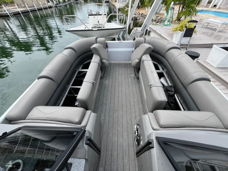 Slide: The Image of 2021 Tahoe Grand Tahoe ELW boat interior with spacious seating and modern design. - 25