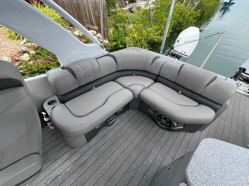 Slide: The Image of Luxurious seating on 2021 Tahoe Grand Tahoe ELW boat, featuring sleek gray upholstery. - 35
