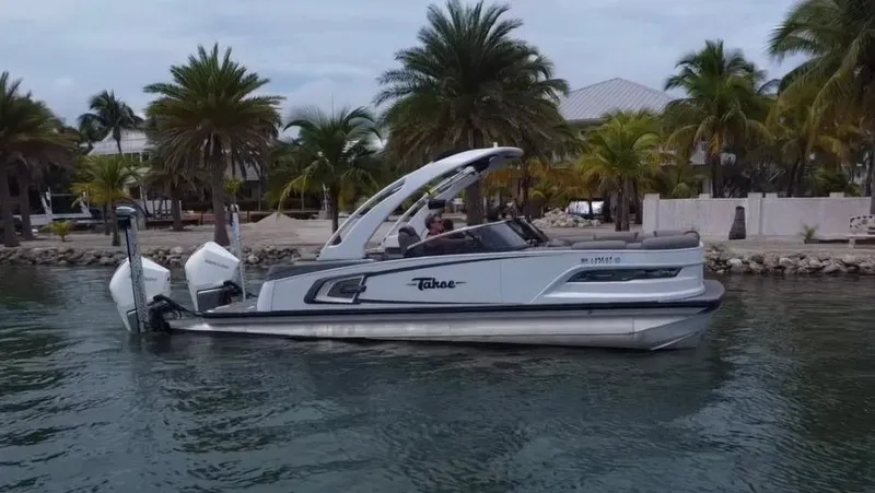 Slide: The Image of 2021 Tahoe Grand Tahoe ELW boat cruising near tropical shoreline. - 45