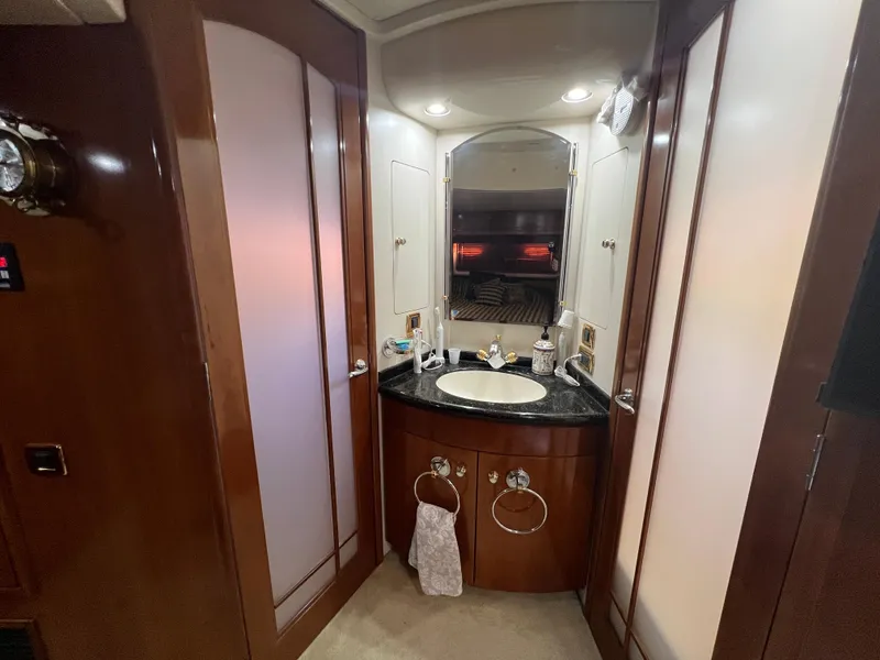 Slide: The Image of Luxurious bathroom interior of 2001 Carver 530 VOYAGER yacht with wood accents and modern fixtures. - 10