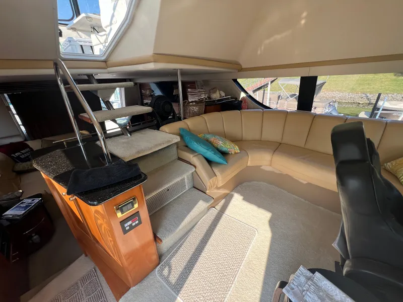 Slide: The Image of Interior of 2001 Carver 530 Voyager yacht with beige seating and modern design. - 16