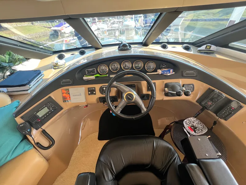 Slide: The Image of Interior helm of 2001 Carver 530 VOYAGER yacht with steering wheel and control panel. - 17