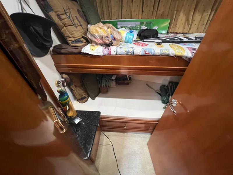 Slide: The Image of Interior cabin of 2001 Carver 530 VOYAGER with bunk bed and storage. - 7