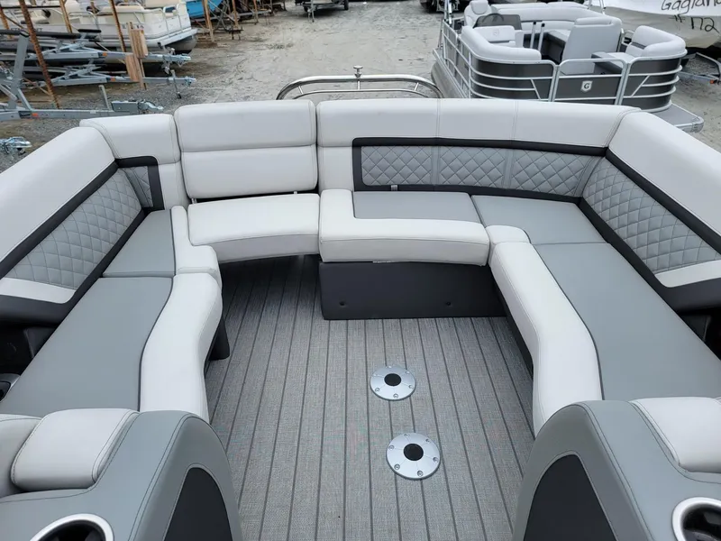 Slide: The Image of Luxurious seating on 2025 Godfrey AquaPatio 255 ULC pontoon boat, featuring elegant gray upholstery. - 14