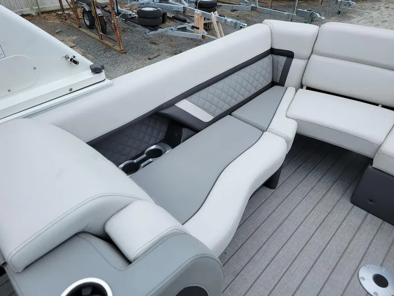 Slide: The Image of 2025 Godfrey AquaPatio 255 ULC boat interior with luxurious seating and modern design. - 16