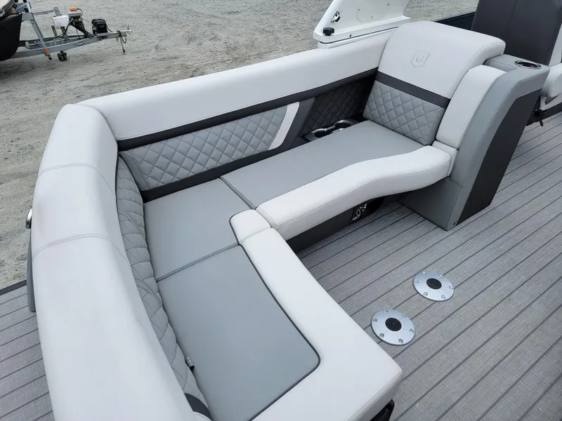 Slide: The Image of Luxurious seating on 2025 Godfrey AquaPatio 255 ULC pontoon boat, featuring elegant gray upholstery. - 19