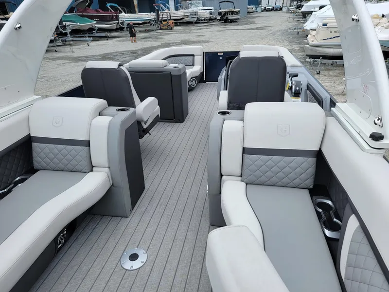 Slide: The Image of Luxurious 2025 Godfrey AquaPatio 255 ULC pontoon boat with spacious seating and modern design. - 20