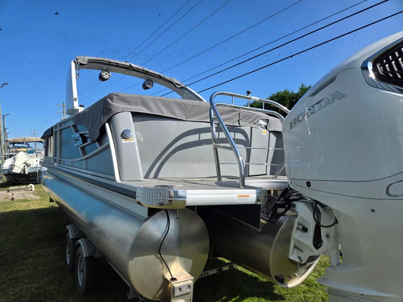 Slide: The Image of 2025 Godfrey AquaPatio 255 ULC pontoon boat with Honda outboard motor. - 4