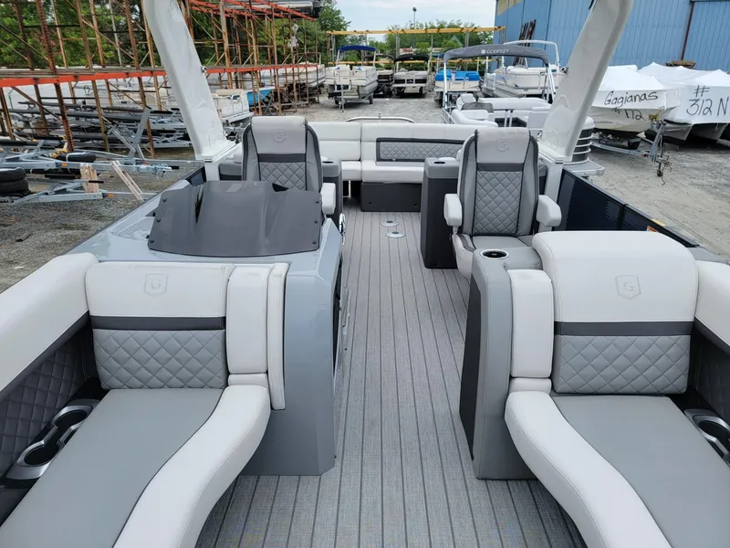 Slide: The Image of 2025 Godfrey AquaPatio 255 ULC pontoon boat with luxurious seating and modern design. - 7