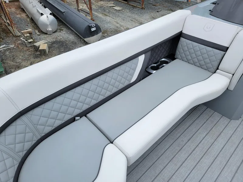 Slide: The Image of Luxurious seating on 2025 Godfrey AquaPatio 255 ULC pontoon boat with quilted upholstery. - 8