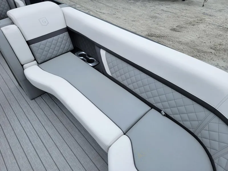Slide: The Image of Luxurious seating on 2025 Godfrey AquaPatio 255 ULC boat with quilted upholstery. - 9