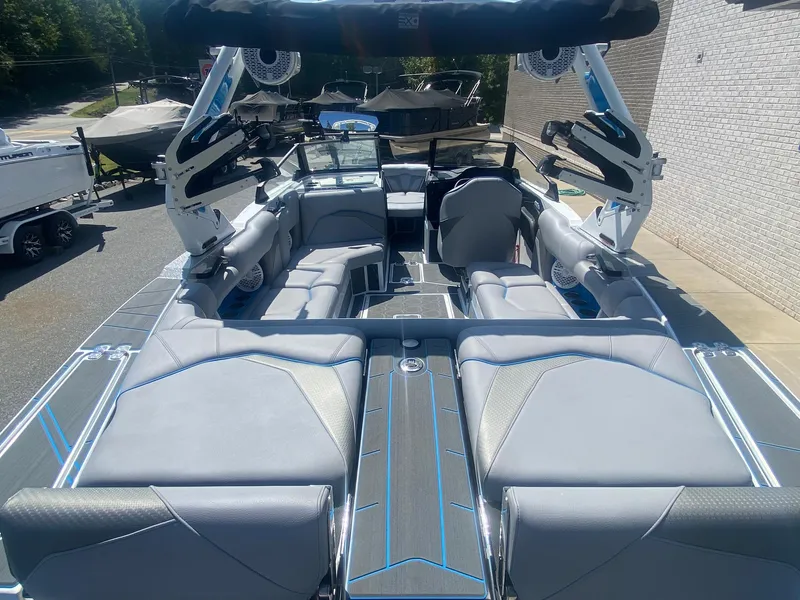 Slide: The Image of 2025 Centurion Fe23 boat interior with sleek gray seating and modern design. - 16