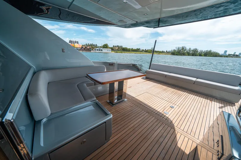 Slide: The Image of Luxurious 2017 Riva 76' Perseo yacht deck with elegant seating and scenic water view. - 12