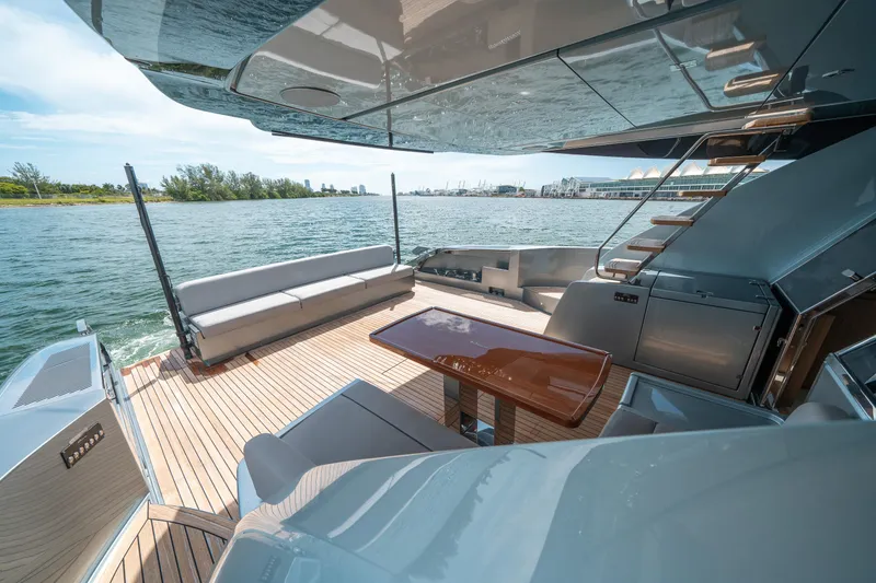 Slide: The Image of Luxurious 2017 Riva 76' Perseo yacht deck with elegant seating and scenic water view. - 13