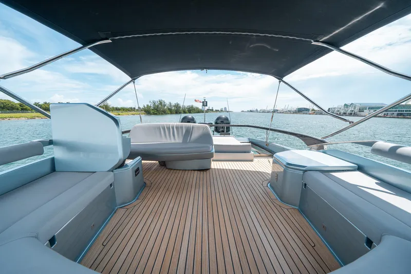 Slide: The Image of Luxurious 2017 Riva 76' Perseo yacht deck with seating, overlooking serene waters. - 18