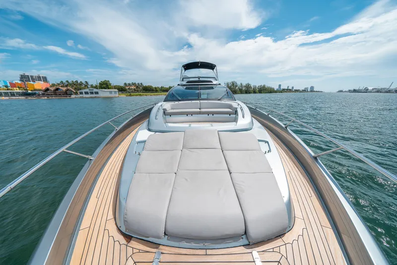 Slide: The Image of Luxurious 2017 Riva 76' Perseo yacht on serene water, featuring spacious sun deck. - 23