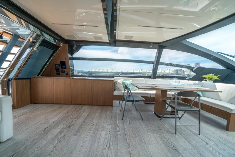 Slide: The Image of Luxurious interior of 2017 Riva 76' Perseo yacht with modern seating and panoramic views. - 28