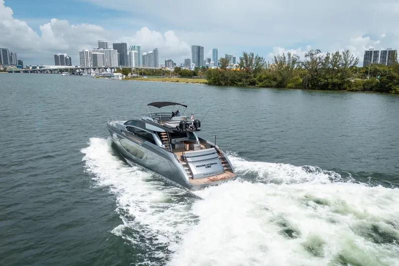 Slide: The Image of Luxury 2017 Riva 76' Perseo yacht cruising near city skyline. - 4