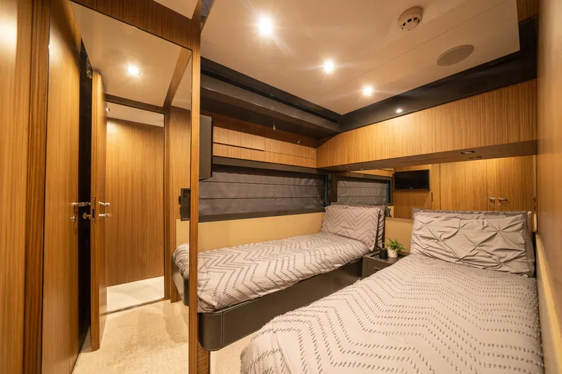 Slide: The Image of Luxurious twin cabin interior of 2017 Riva 76' Perseo yacht with modern wood paneling. - 47