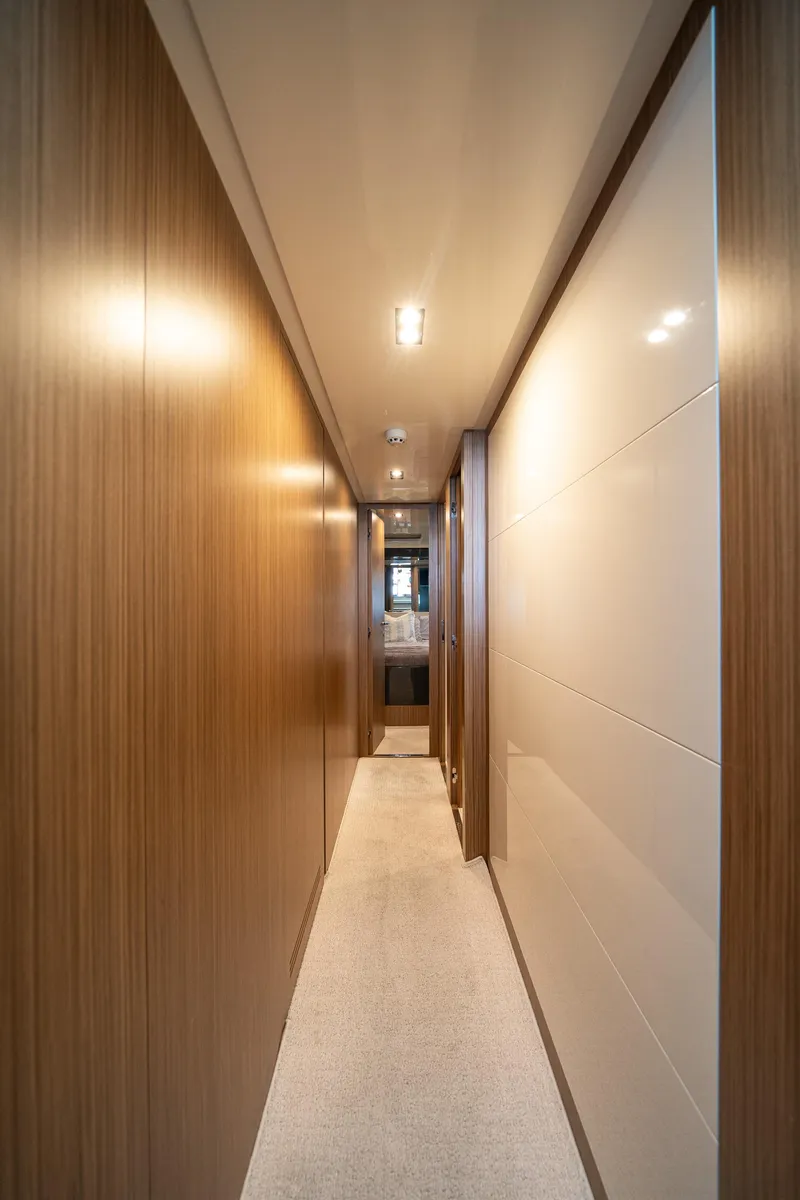Slide: The Image of Luxurious hallway interior of 2017 Riva 76' Perseo yacht with wood paneling. - 49