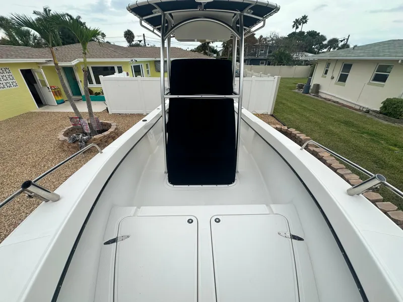 Slide: The Image of 2017 May-Craft 2300CCX boat in residential backyard setting. - 19