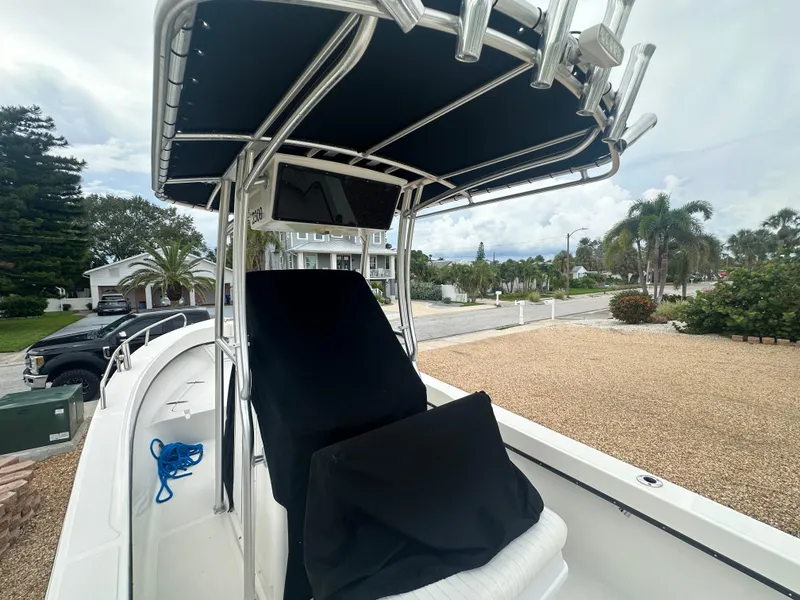 Slide: The Image of 2017 May-Craft 2300CCX boat with black canopy and console cover. - 20