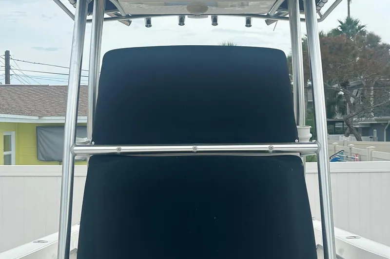 Slide: The Image of 2017 May-Craft 2300CCX boat with T-top and black console cover. - 21