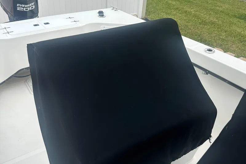 Slide: The Image of 2017 May-Craft 2300CCX boat with covered console and Evinrude 200 engine. - 23