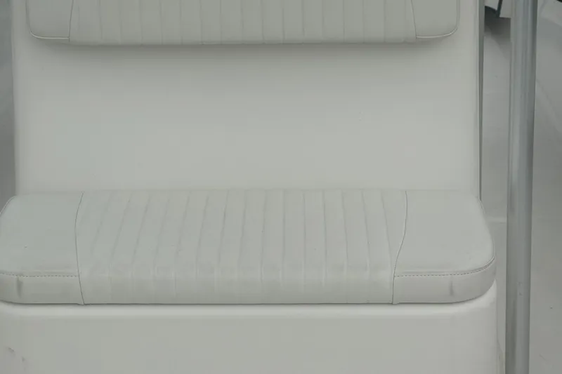 Slide: The Image of May-Craft 2300CCX 2017 boat seat, white upholstery, close-up view. - 25