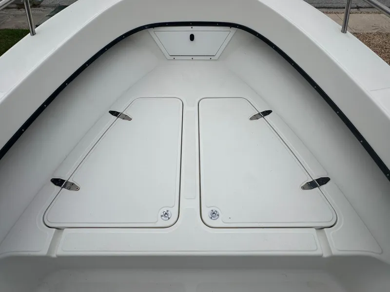 Slide: The Image of 2017 May-Craft 2300CCX boat interior, featuring spacious storage compartments. - 29