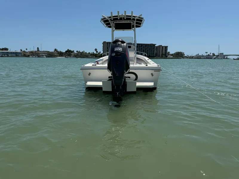Slide: The Image of 2017 May-Craft 2300CCX boat on calm water, rear view. - 3