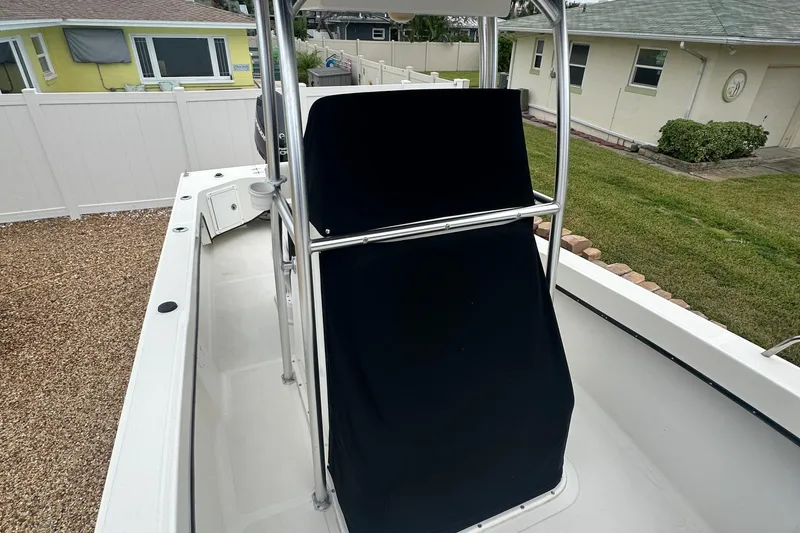 Slide: The Image of 2017 May-Craft 2300CCX boat with covered console, parked in residential yard. - 31