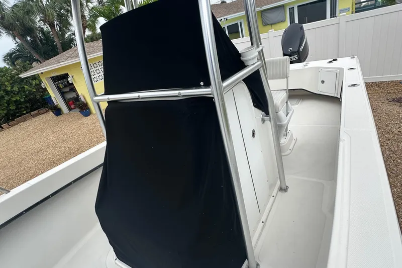 Slide: The Image of 2017 May-Craft 2300CCX boat with covered console, parked in a residential area. - 32