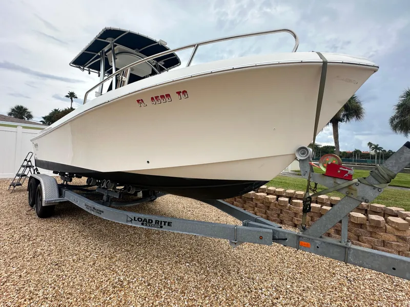 Slide: The Image of 2017 May-Craft 2300CCX boat on trailer, parked outdoors. - 46