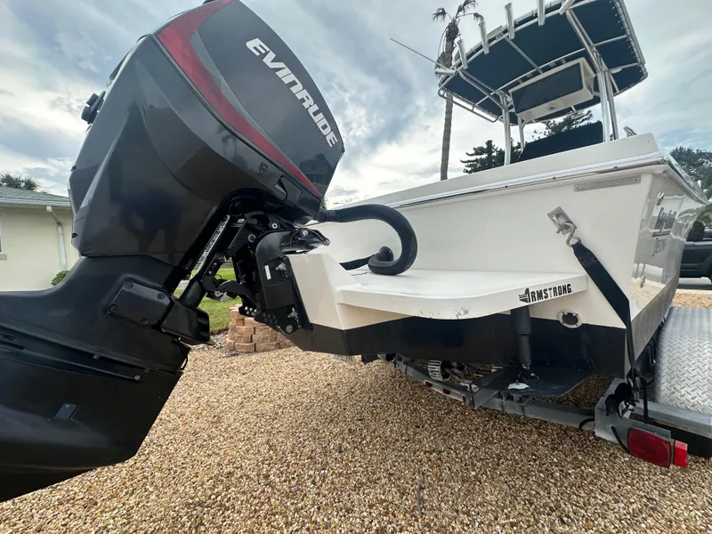 Slide: The Image of 2017 May-Craft 2300CCX boat with Evinrude outboard motor on a trailer. - 9