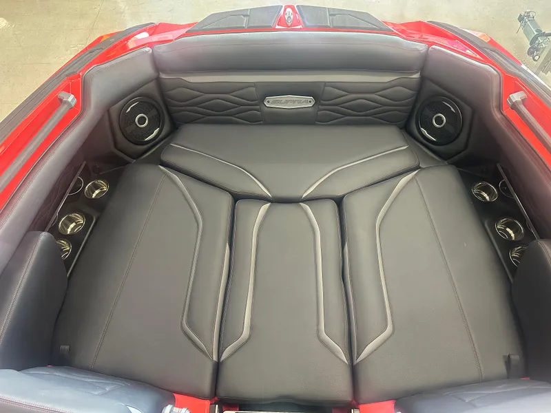 Slide: The Image of 2025 Supra SA 450 boat interior with premium seating and sound system. - 12