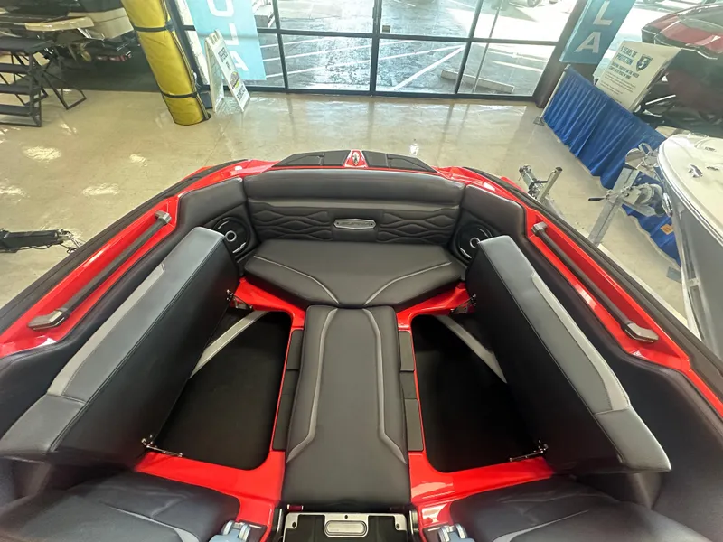 Slide: The Image of 2025 Supra SA 450 boat interior with sleek black and red seating. - 14
