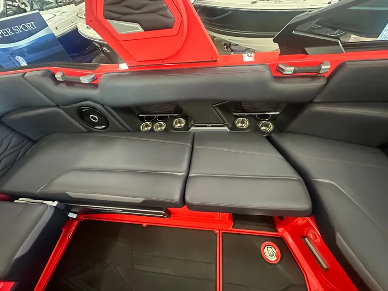 Slide: The Image of 2025 Supra SA 450 interior with sleek black seating and modern design elements. - 18