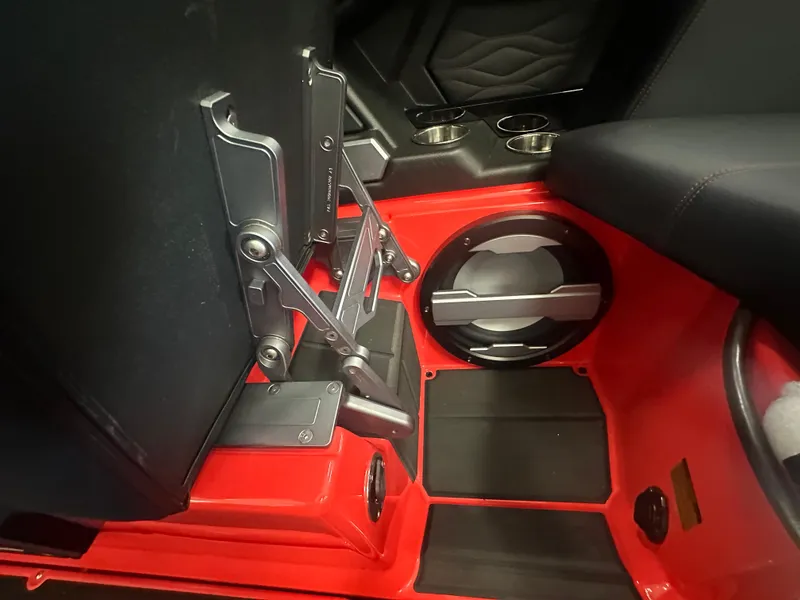 Slide: The Image of 2025 Supra SA 450 interior with red accents and cup holders. - 20