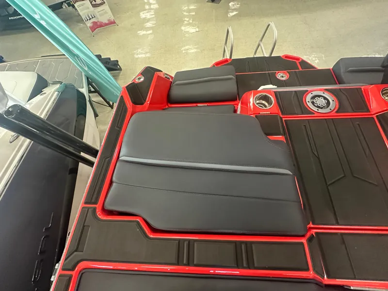 Slide: The Image of 2025 Supra SA 450 boat interior with sleek black and red seating design. - 25