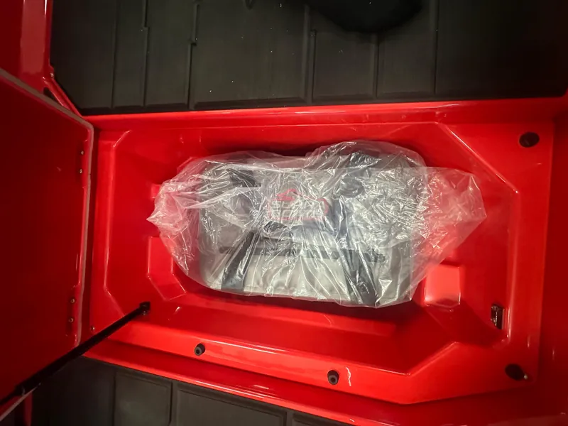 Slide: The Image of Red Supra SA 450 engine compartment, 2025 model, with engine wrapped in plastic. - 29
