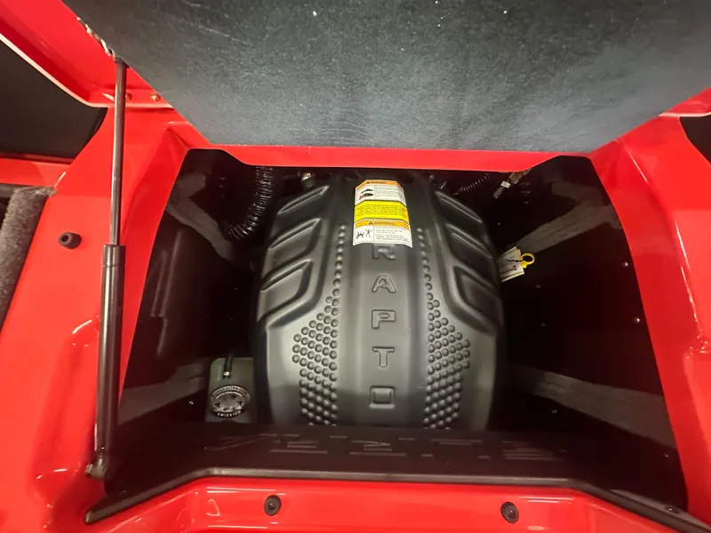 Slide: The Image of 2025 Supra SA 450 engine compartment with RAPTOR cover, red exterior detailing. - 30