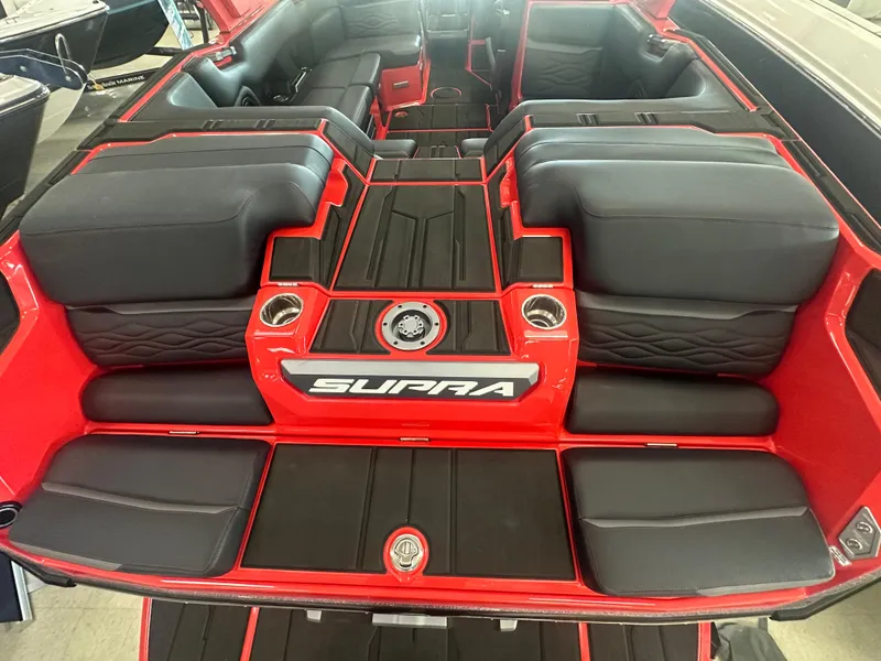 Slide: The Image of 2025 Supra SA 450 boat interior with red and black seating, stylish design. - 32