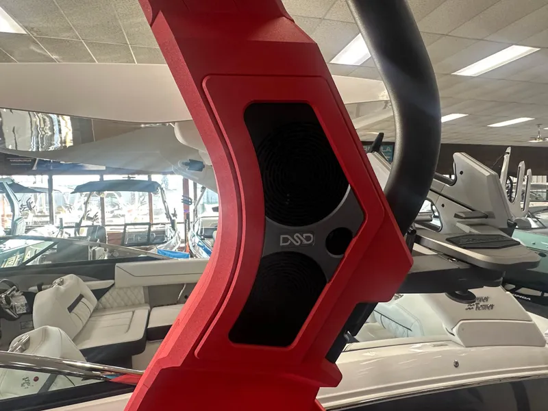 Slide: The Image of 2025 Supra SA 450 boat interior with red speaker system. - 35