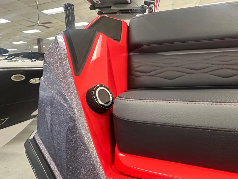 Slide: The Image of 2025 Supra SA 450 boat interior with red and black seating detail. - 42