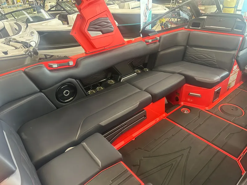 Slide: The Image of 2025 Supra SA 450 boat interior with black and red seating, modern design. - 45