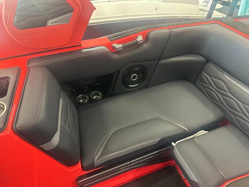 Slide: The Image of Luxurious interior of 2025 Supra SA 450 boat with sleek black and red seating. - 46