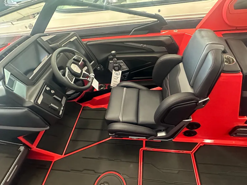 Slide: The Image of 2025 Supra SA 450 boat interior with black leather seats and red accents. - 47