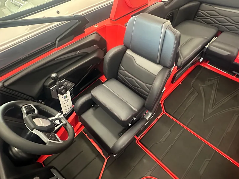 Slide: The Image of 2025 Supra SA 450 interior with black leather seats and red accents. - 48
